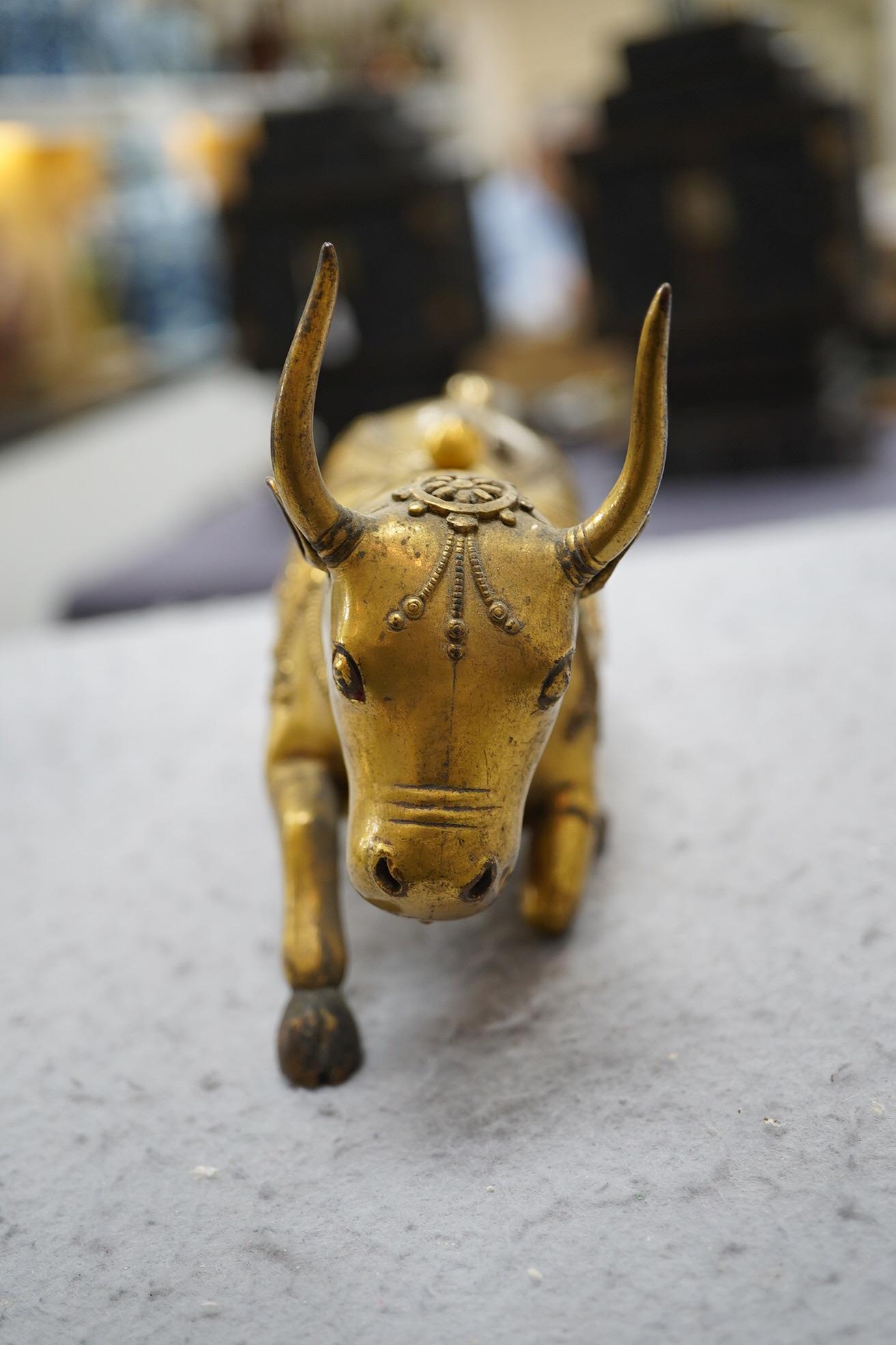 A Tibetan gilt bronze figure of a buffalo, 18th century